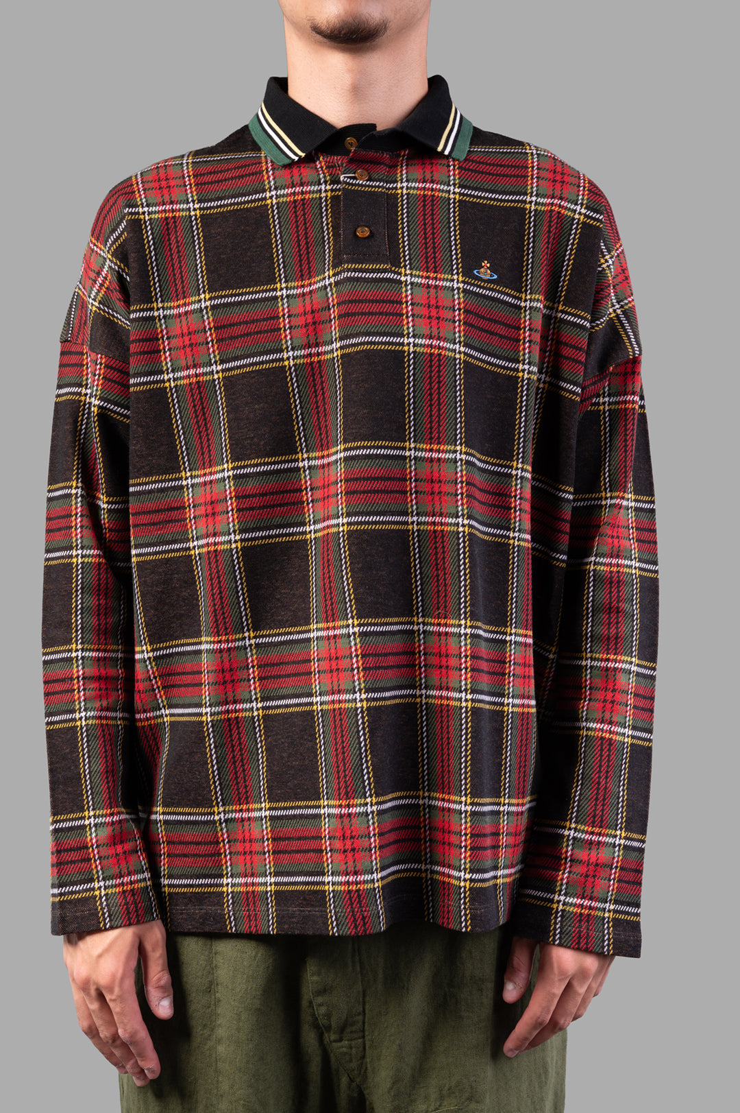 Vivienne Westwood Long-Sleeve Tartan Polo Shirt featuring a dark red tartan pattern, long sleeves, and button detail on.