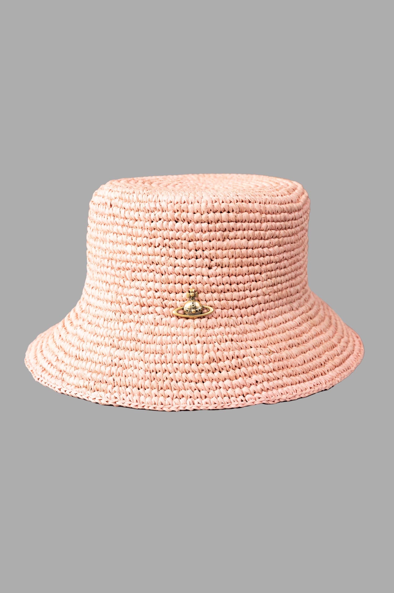 Vivienne Westwood Orb Raffia Bucket Hat in pink powder, showcasing front view with raised orb plaque and woven texture.