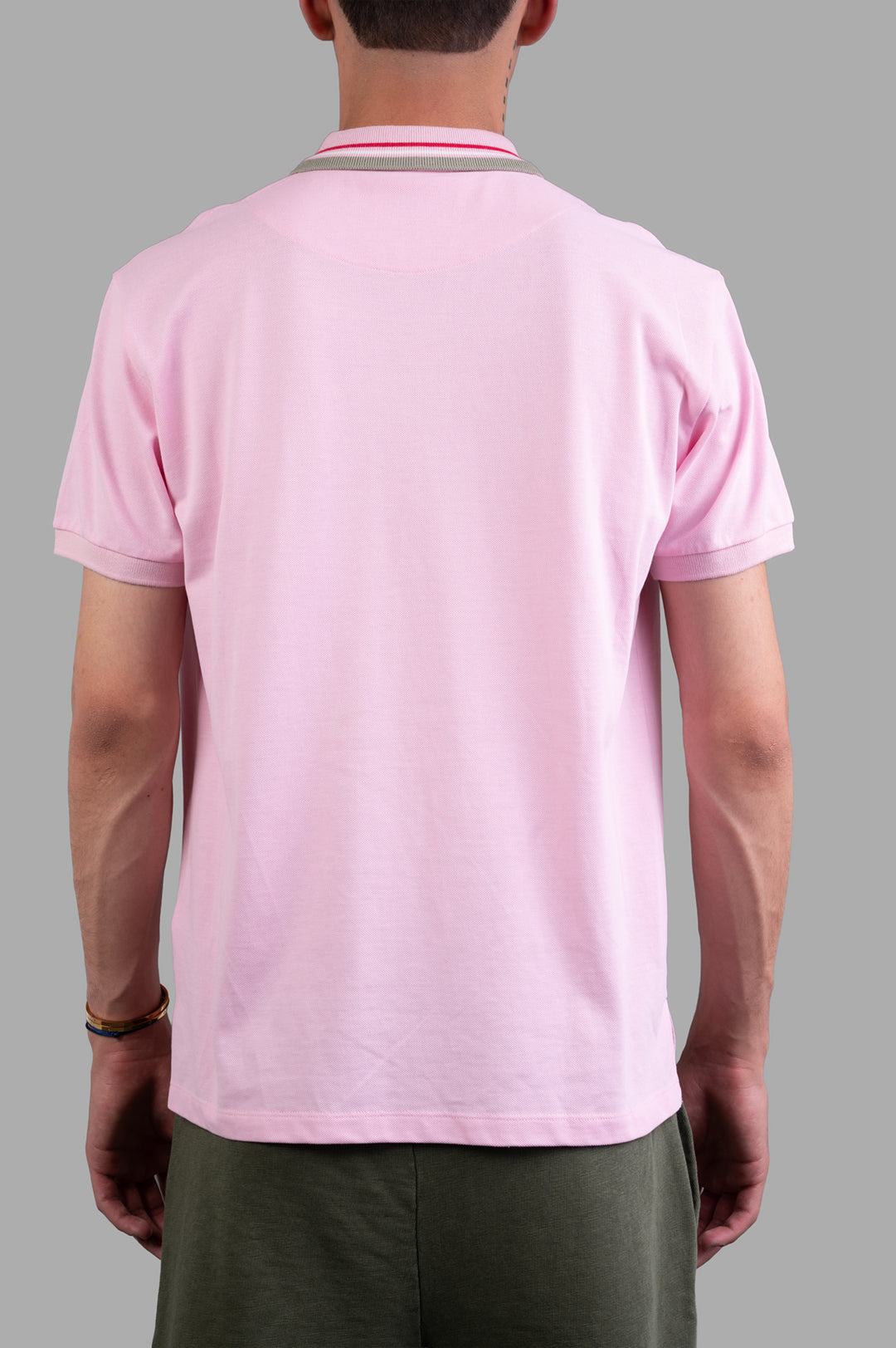 Vivienne Westwood Classic Logo Polo Shirt in pink, featuring a back view with subtle striped detailing and a comfortable fit.