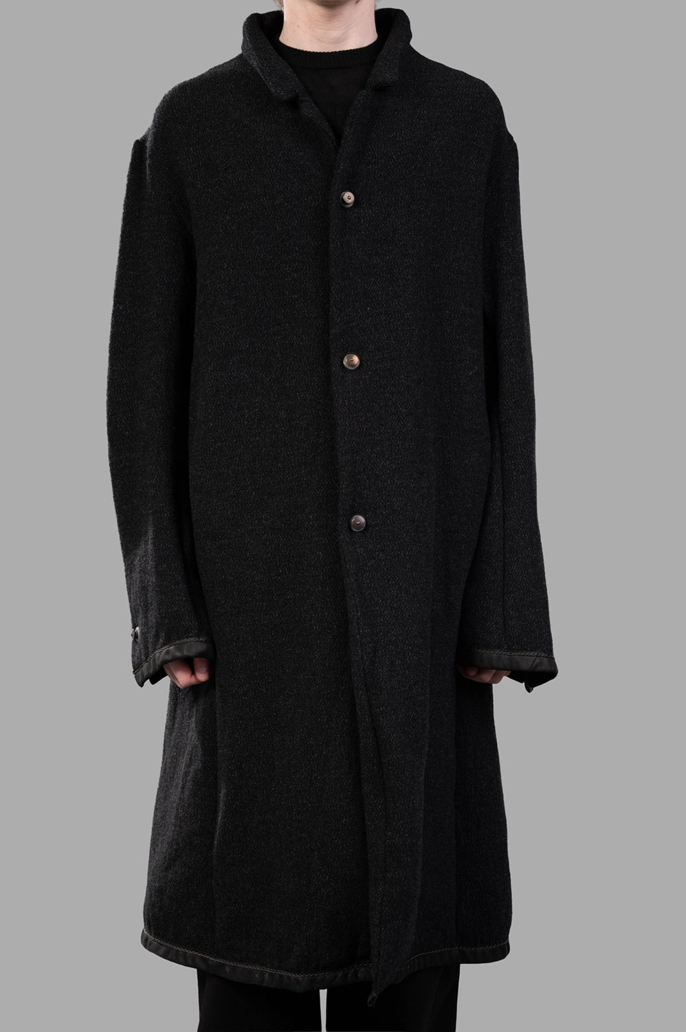 69 by Isaac Sellam coat in black, front view, three-button closure and leather-trim cuffs