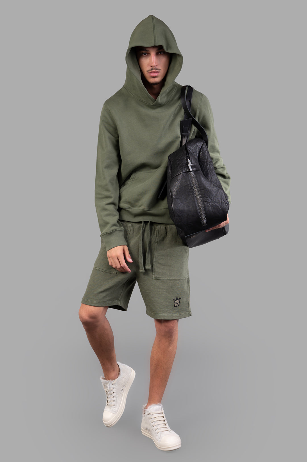 Zadig & Voltaire Sanchi Sweatshirt, green, on-model front view with hoodie, styled with shorts and white sneakers.