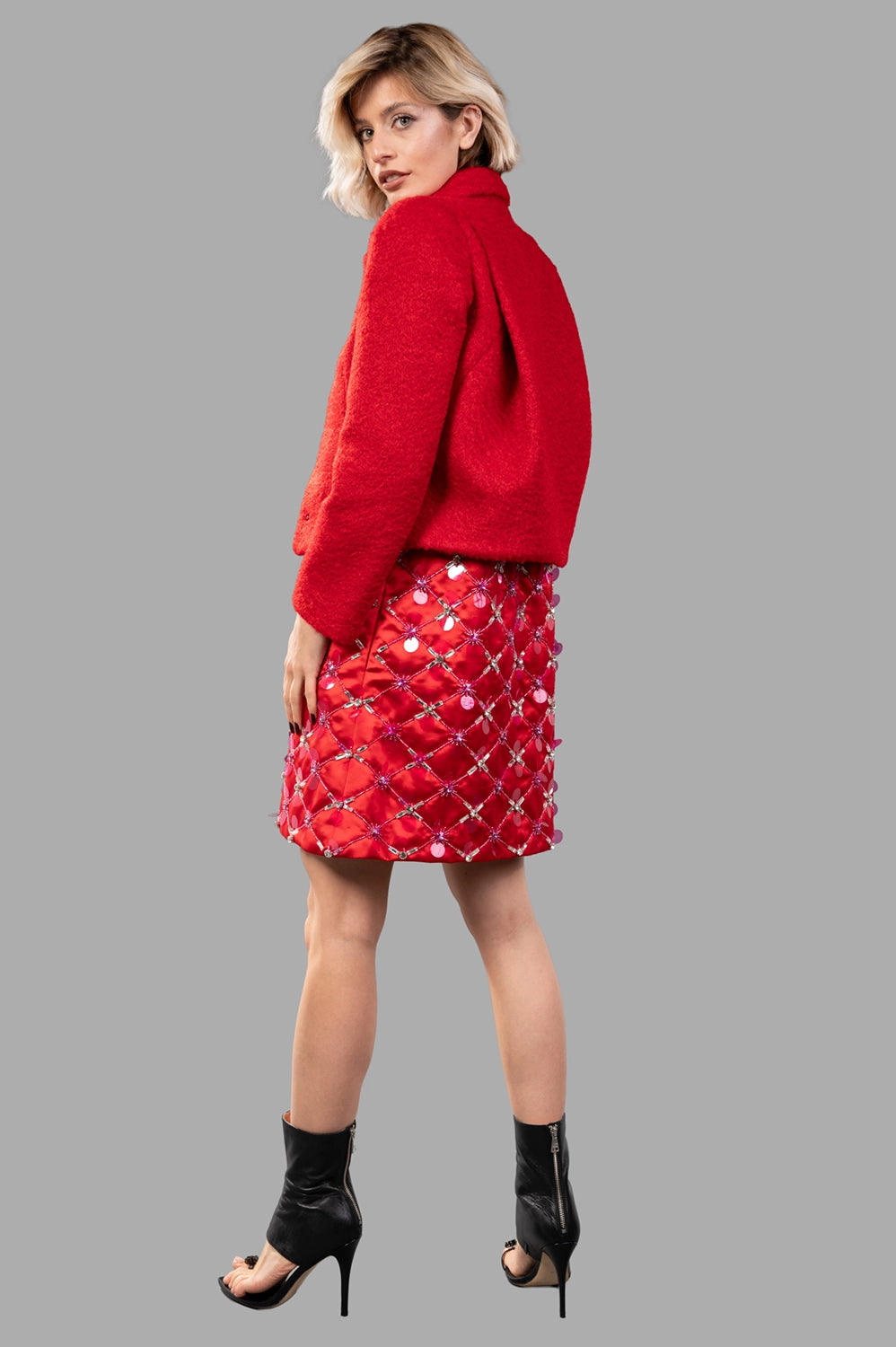 DES PHEMMES Fitted Hunter Jacket in red, featuring a rounded collar and textured fabric, shown on-model from the back.