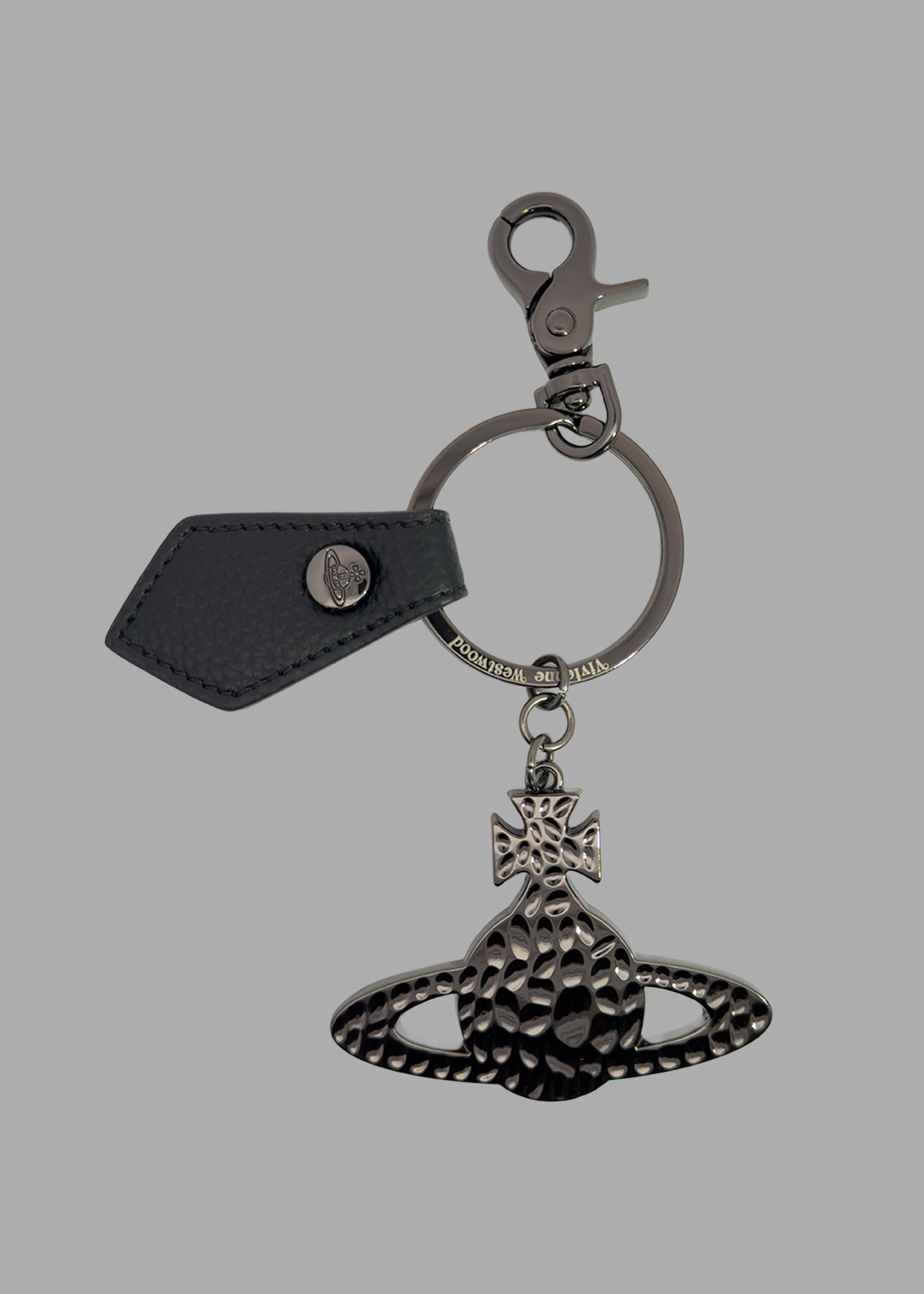 Vivienne Westwood Hammered Orb Keyring with black saffiano leather tab and engraved metal ring, front view.