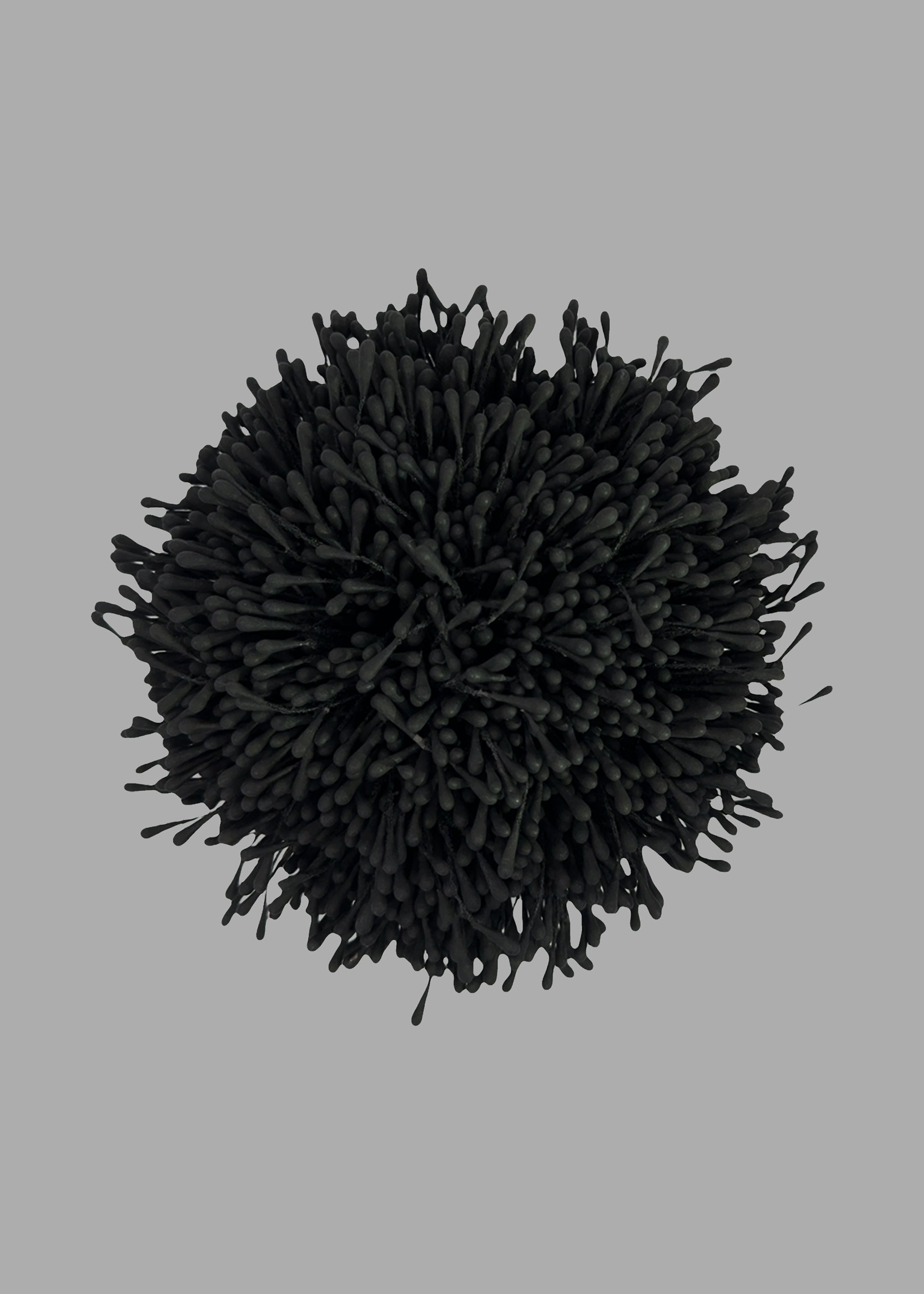 By Malene Birger Henna Brooch in Black, top view. Anemone-inspired design, polyester texture. Elegant accessory piece.