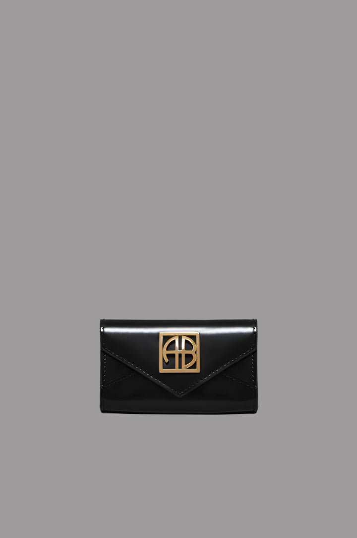 Anine Bing Elly Wallet in high-shine black leather with gold monogram hardware, front view.