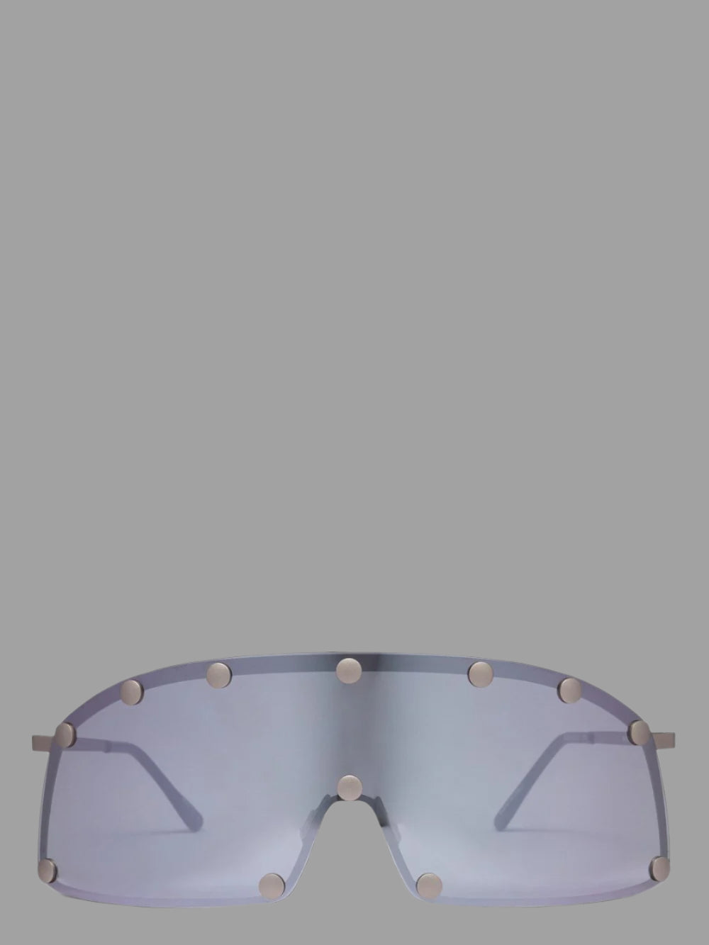 Rick Owens Shielding Sunglasses, front view; silver stainless steel frame, straight-bottomed black lens, rubber nose pad.