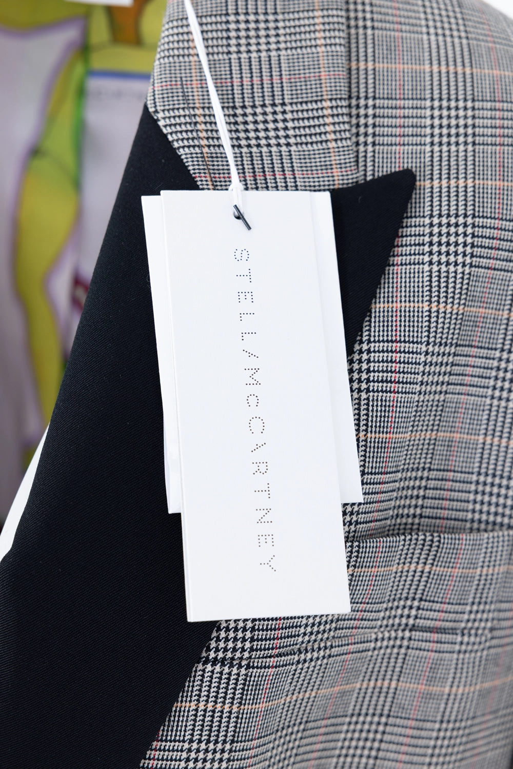 Pre-owned Stella McCartney blazer in grey check, detail view, branded hangtag over black shawl lapel