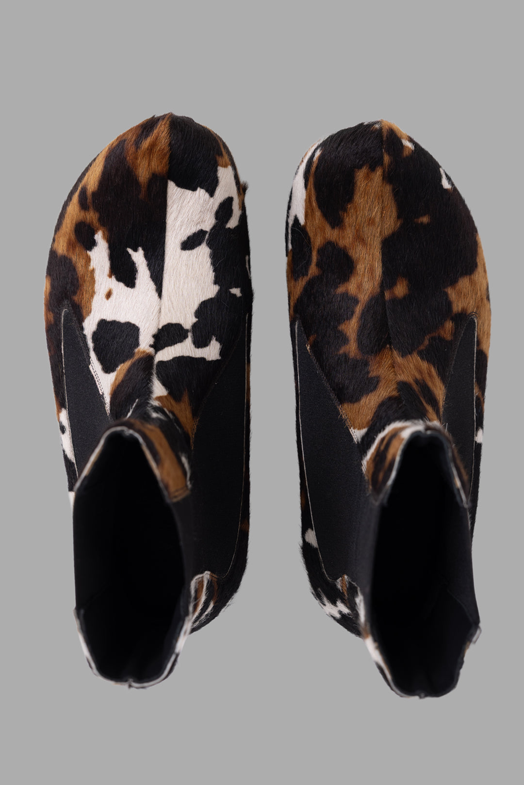 A.W.A.K.E. MODE women's multicolour pony leather ankle boots, top view with all-over animal pattern and elastic gussets.