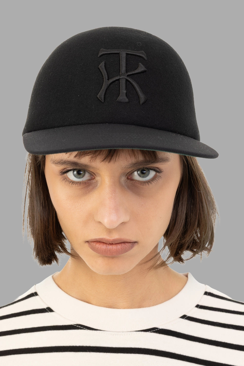 KIJIMA TAKAYUKI unisex baseball cap in black, on-model half-length, raised KT monogram