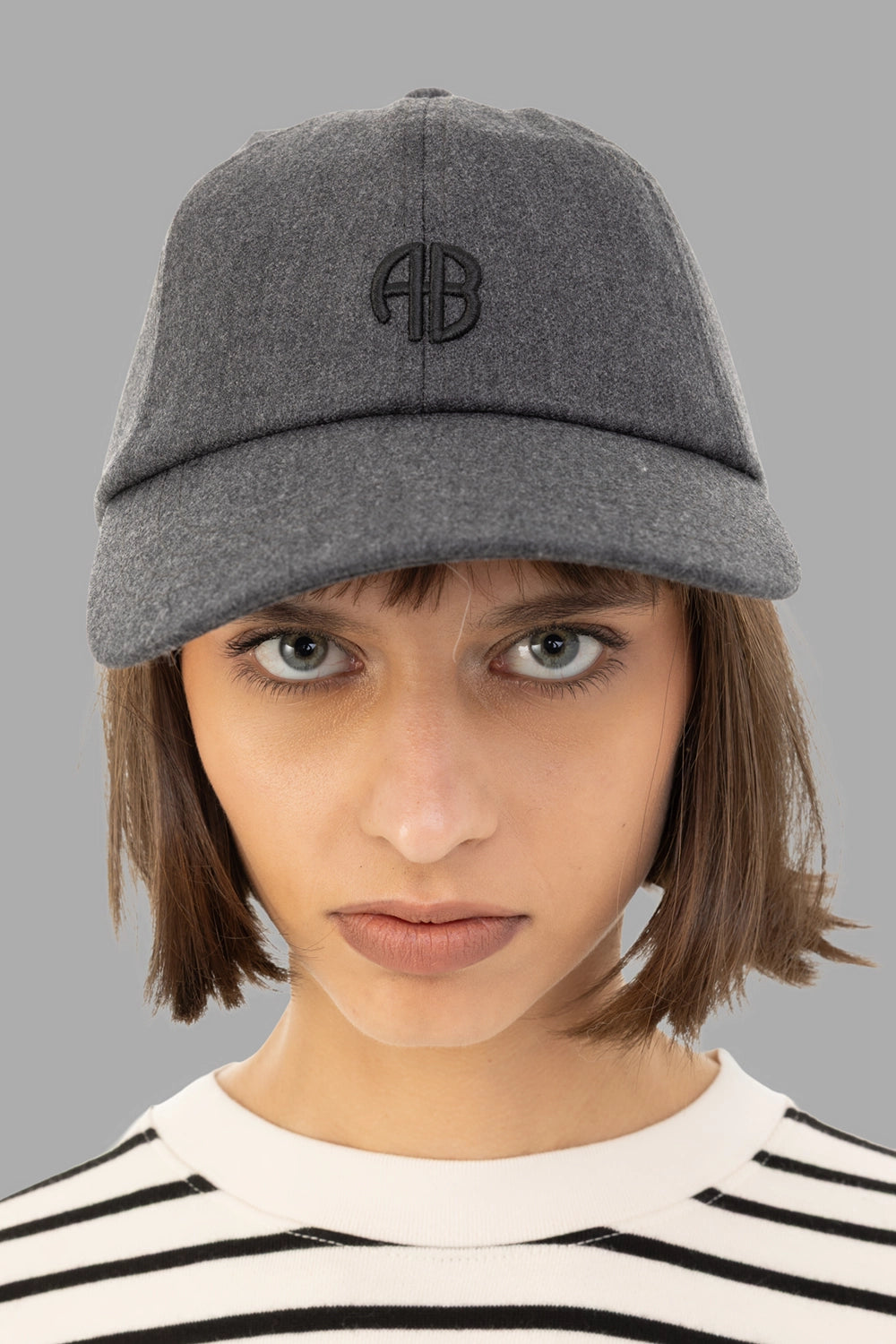Anine Bing women’s baseball cap in dark heather grey, front view with tonal AB monogram and curved brim.