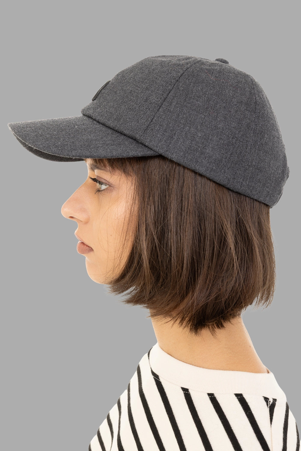 Anine Bing women’s baseball cap in dark heather grey, side view showing six-panel shaping and structured brim.