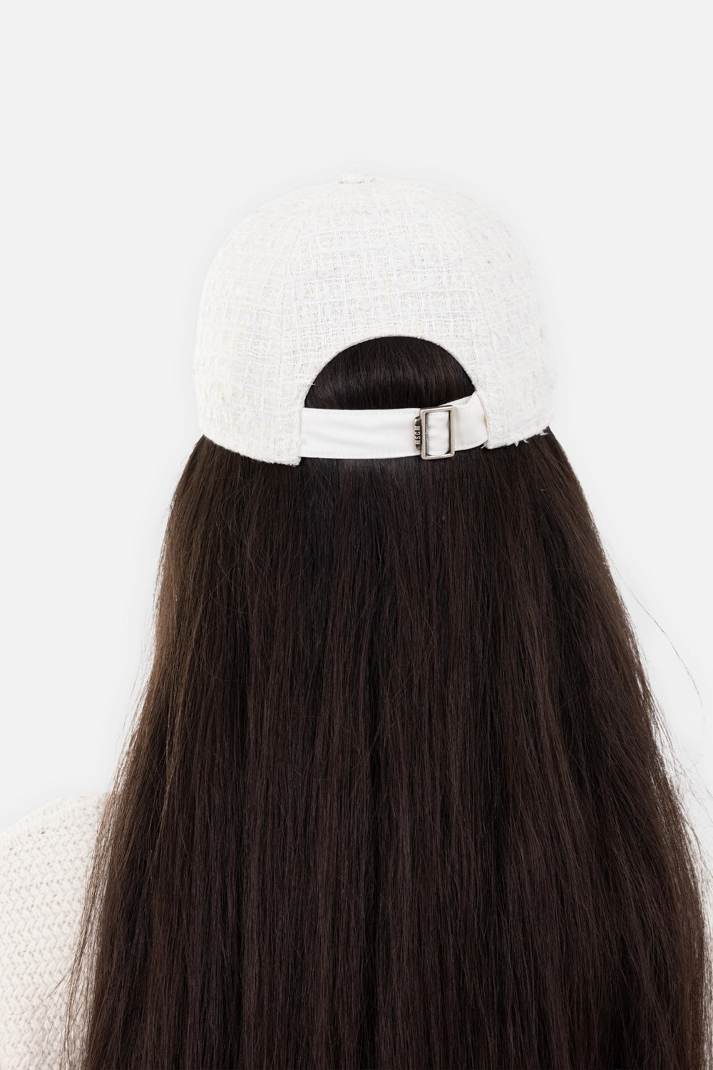 MSGM women's baseball cap in off-white, back view, adjustable strap with metal buckle hardware.