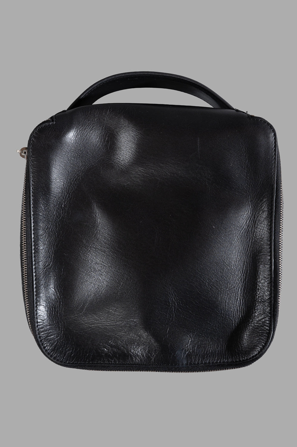 Rick Owens beauty case in black, front view, square silhouette with top handle