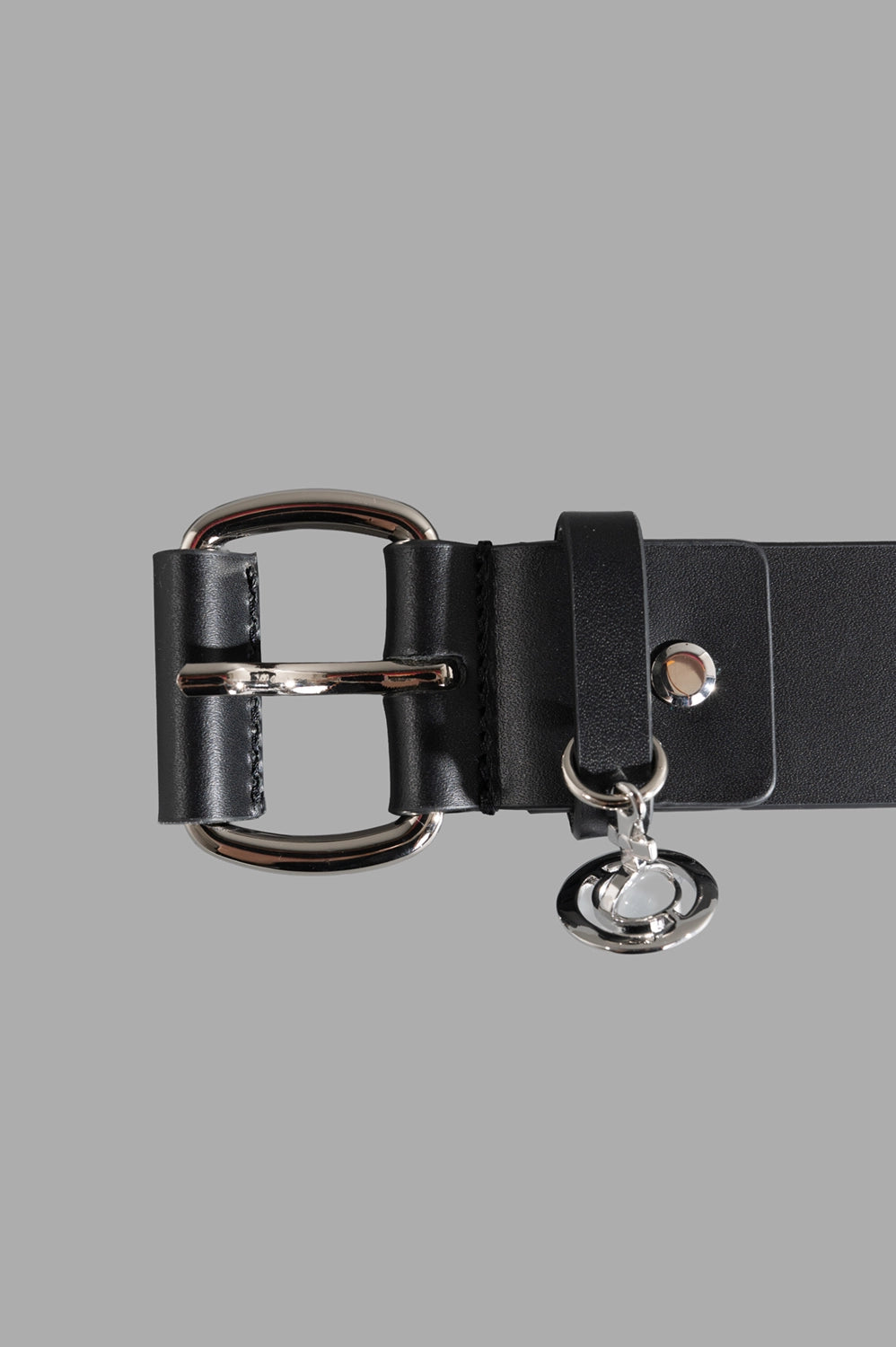 Vivienne Westwood belt in black, hardware close-up, silver double-ring buckle with Orb charm.
