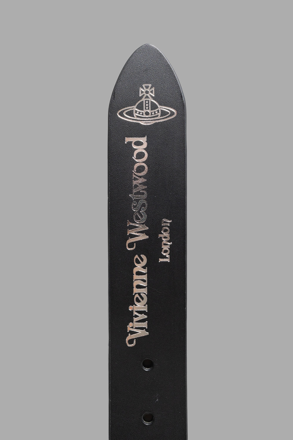 Vivienne Westwood belt in black, logo detail, silver “Vivienne Westwood London” stamp on pointed tip.