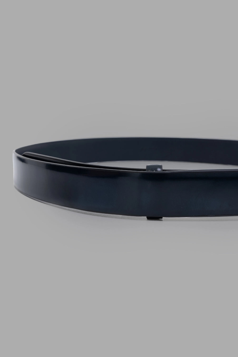 Marsèll leather belt in blue, close-up of punched holes and polished edge finish