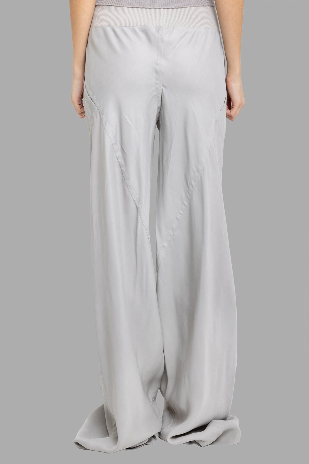Rick Owens women's pearl Bias pants, back view showing V-shaped seamwork and exaggerated pooling hem