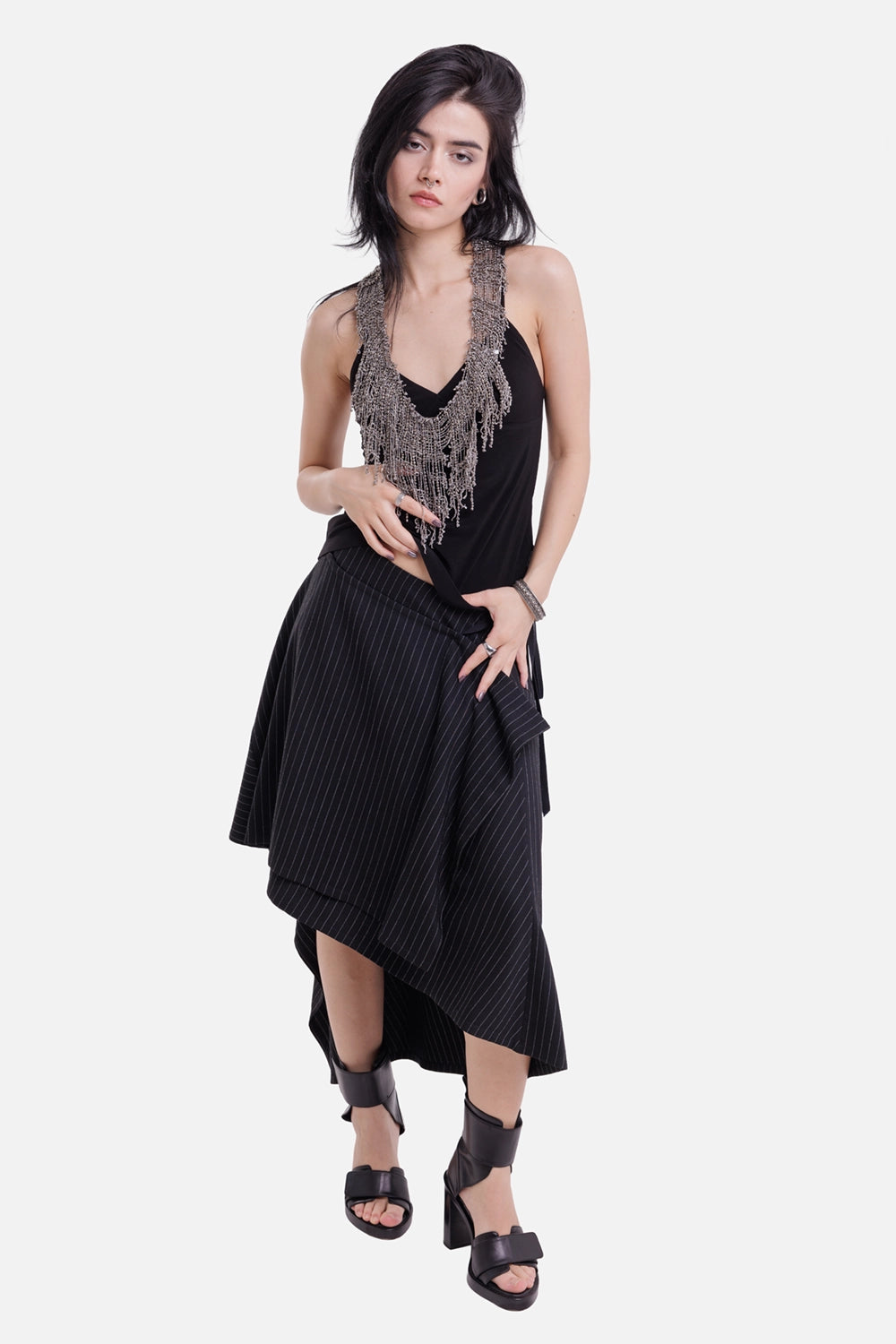 Ann Demeulemeester women's black and grey wrap skirt, full-length model view with chalk stripes and asymmetric hem
