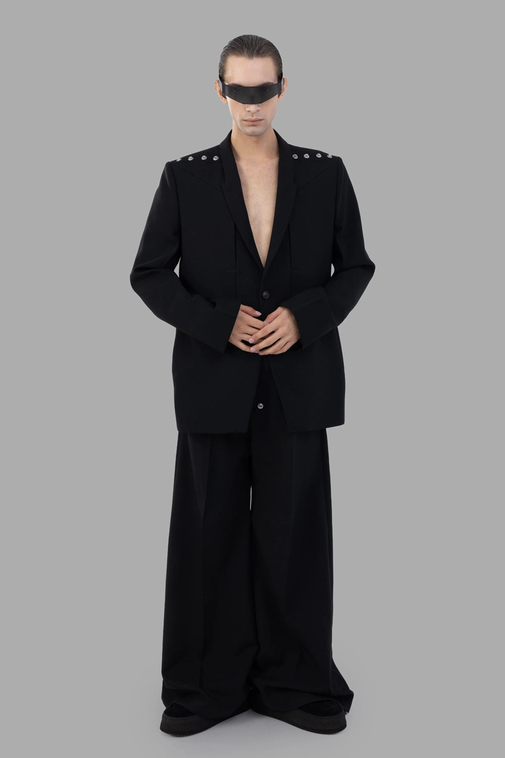 Rick Owens blazer in black, back view, tailored seams and twin vents