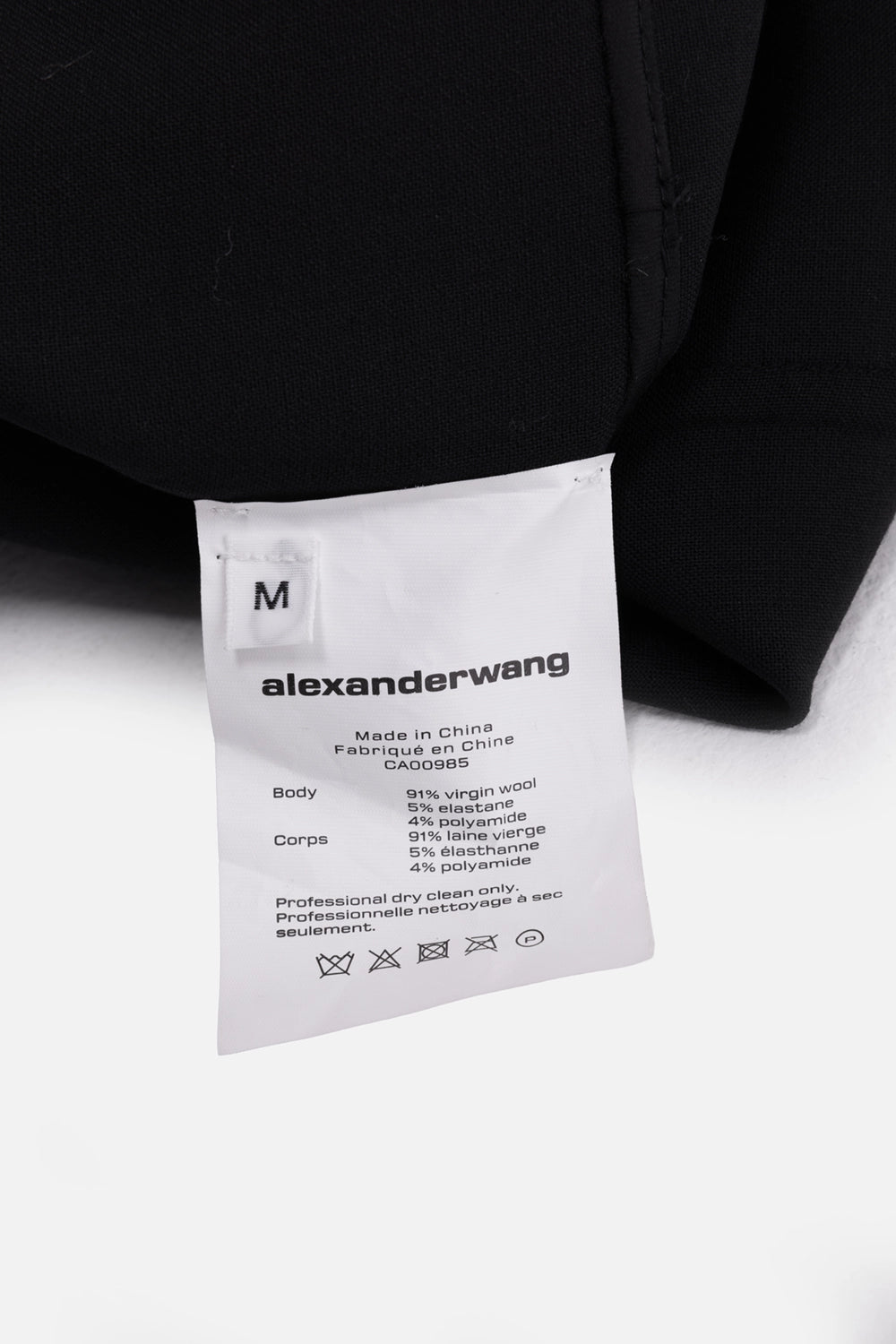 Pre-owned Alexander Wang women's blazer in black, care-tag view, interior label showing size M and fabric composition