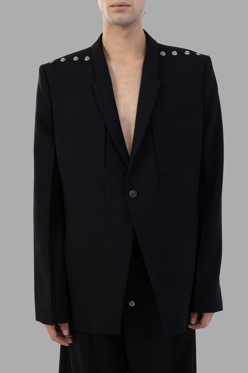 Rick Owens blazer in black, on-model full length, studded shoulder snaps and peaked lapels