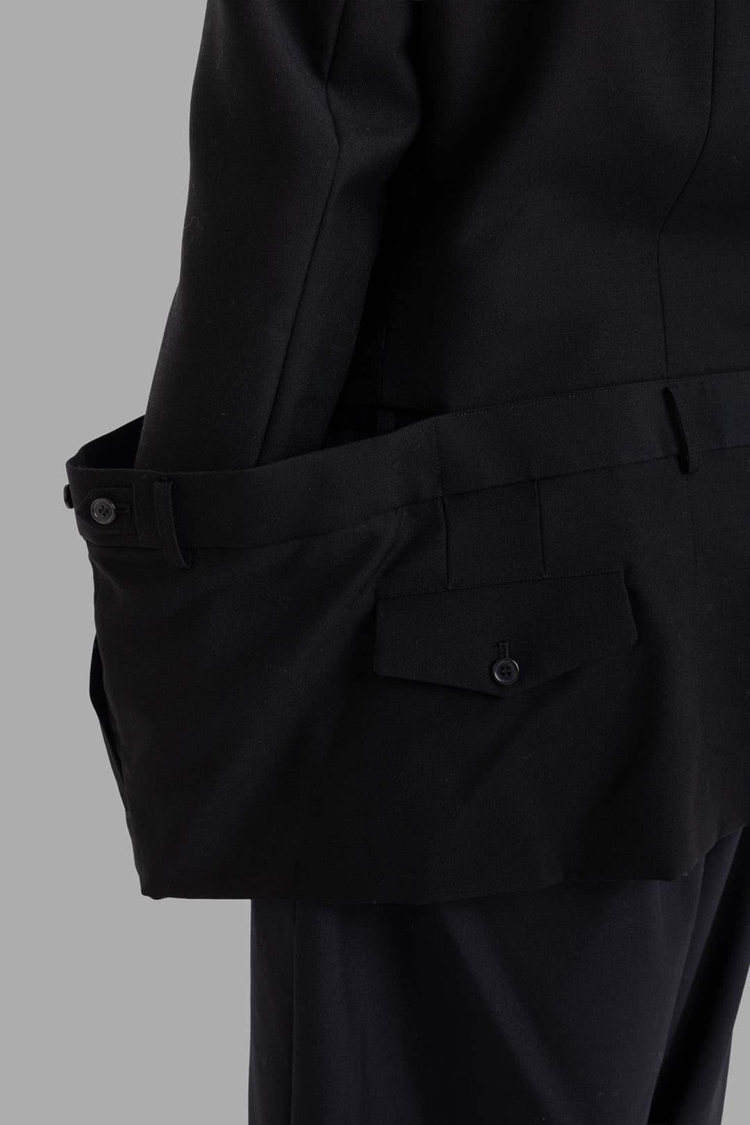 Noir Kei Ninomiya women black blazer, waistband detail, left flap pocket and belt tab opened out