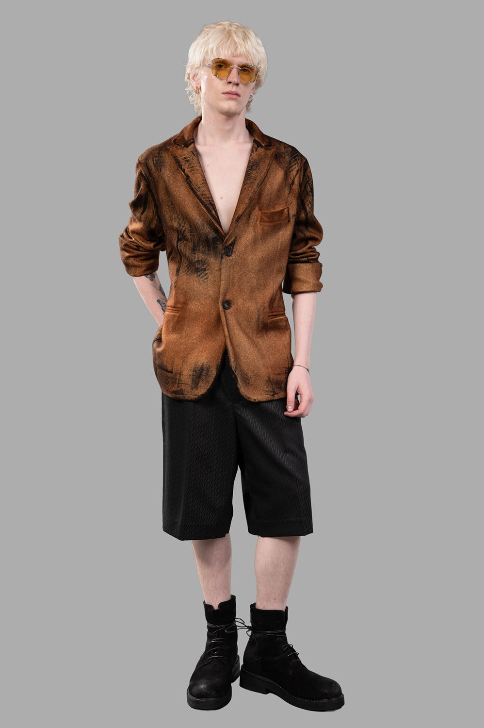Full-length view of spray-dyed wool-cashmere blazer on model, styled open with tailored fit