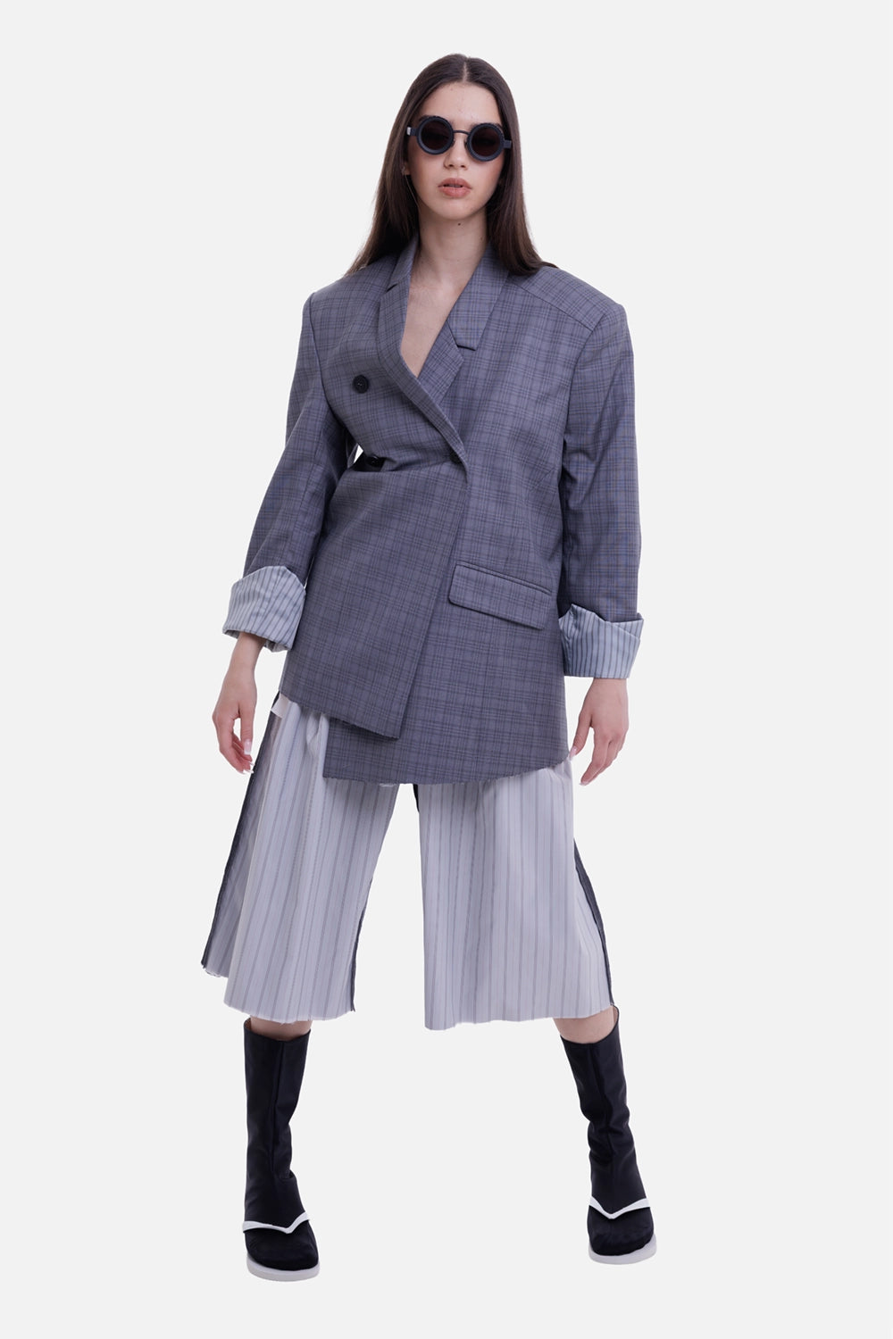 Natasha Zinko women's grey checked blazer, model view with asymmetric front and striped rolled cuffs
