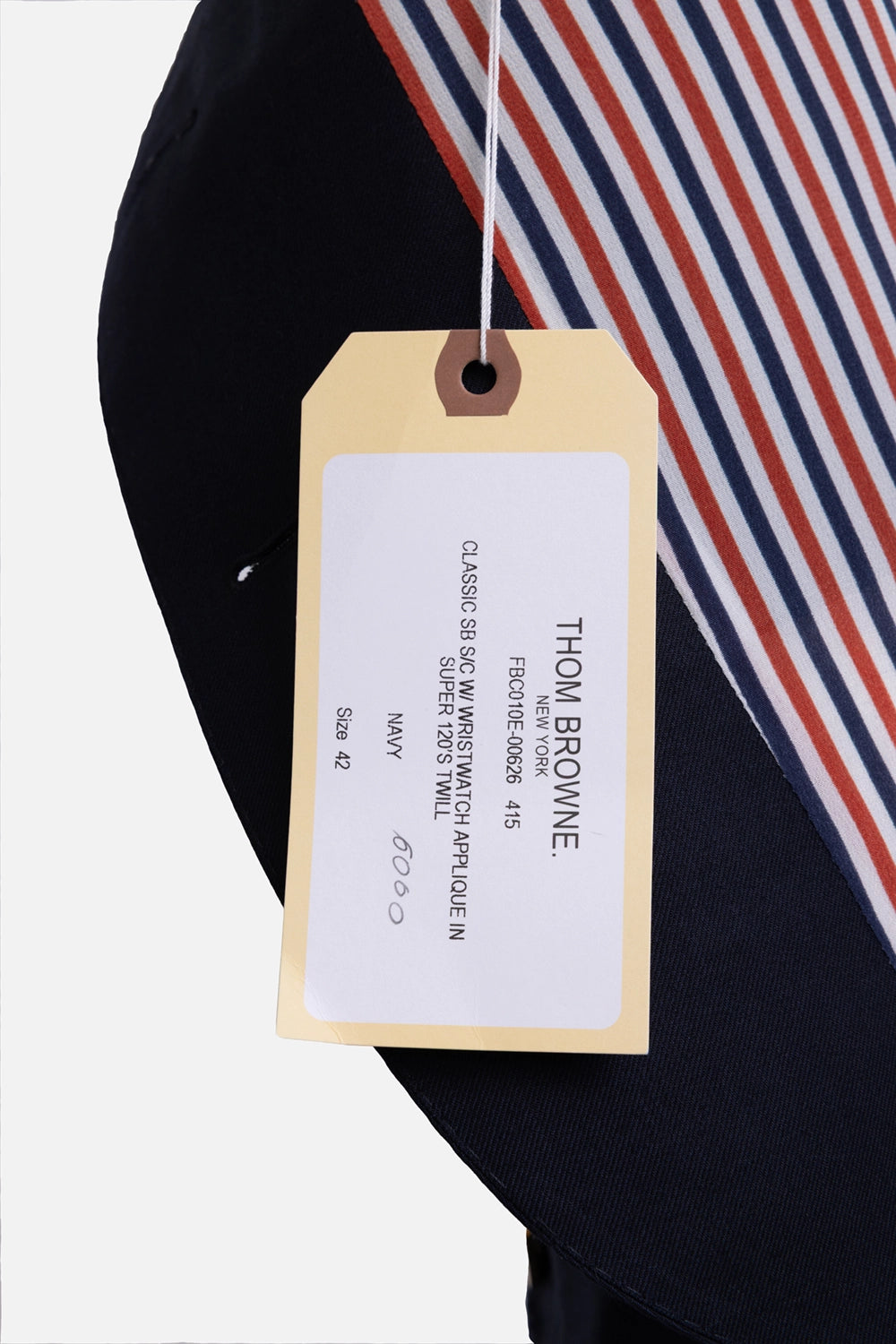 Pre-owned Thom Browne blazer in navy, hangtag close-up, printed style label and size 42