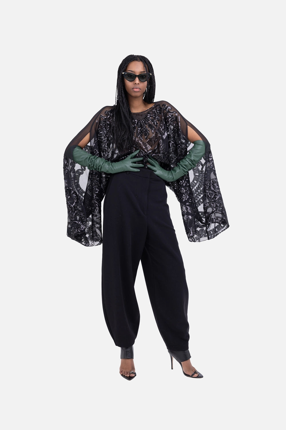 Norma Kamali women’s bodysuit in black, on-model full length, sheer sequin mesh with draped long sleeves