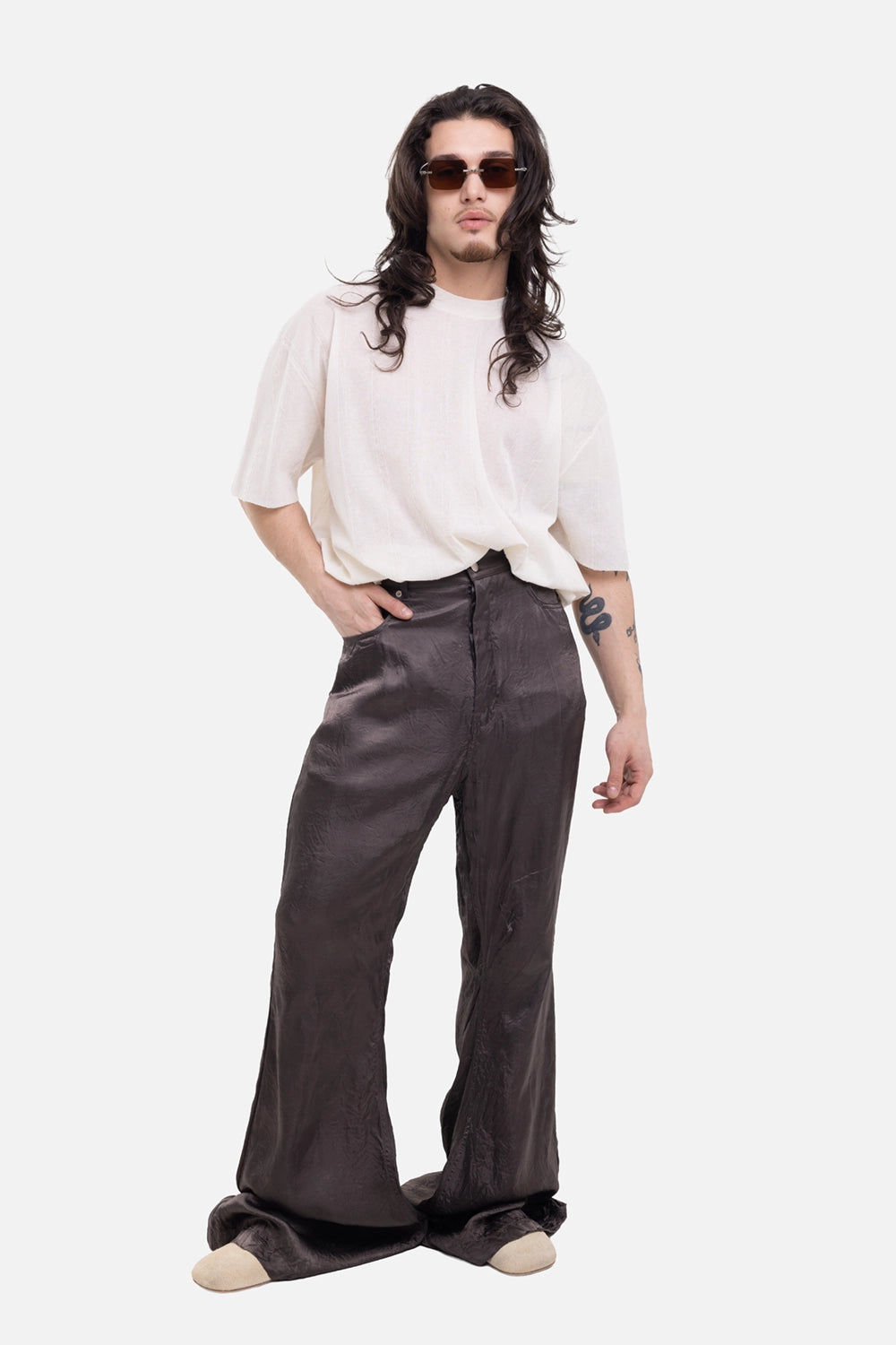 Rick Owens men's Bolan Bootcut trousers in Dark Dust, on-model full-length with glossy stacked hems