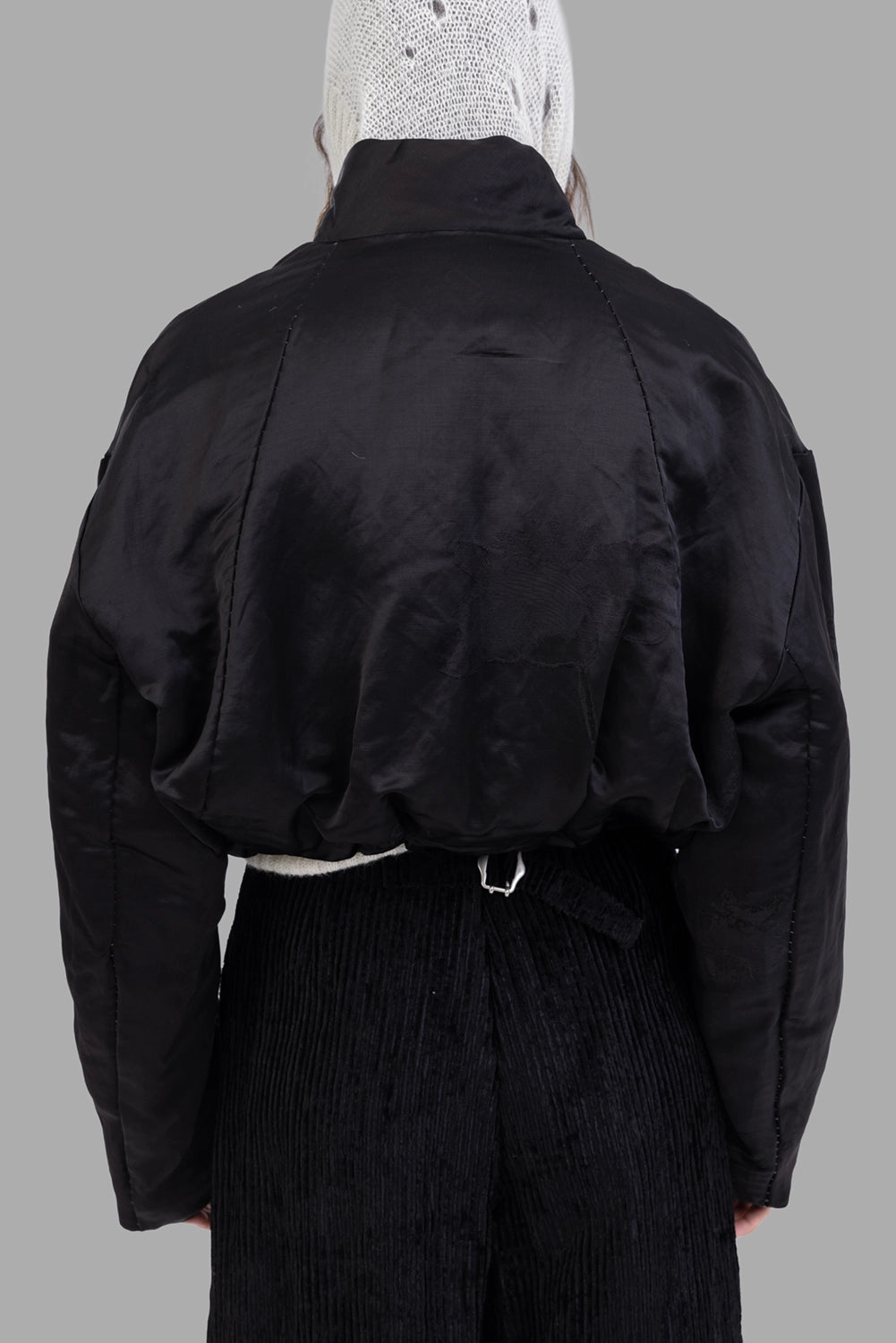 Masnada women's reversible bomber jacket in black, back view, gathered hem and raglan sleeves