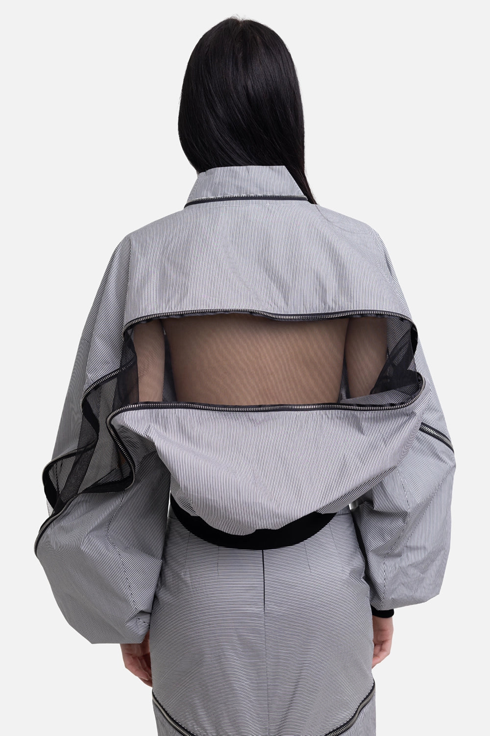 Sehnsucht Atelier women's bomber jacket in black/white, on-model back view, open back panel and mesh inset
