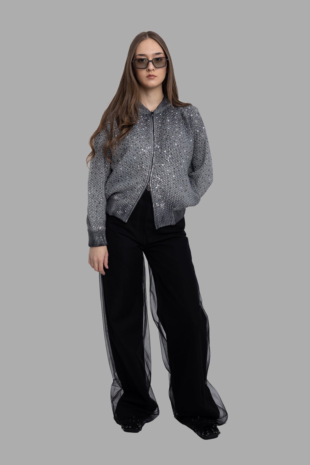 Avant Toi women's grey bomber jacket, on-model full-length front view, sequin-knit body with ribbed collar and hem.