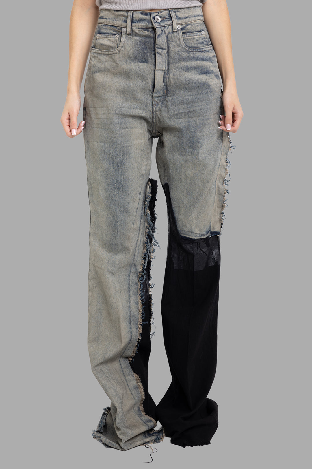 Rick Owens women's Bolan bootcut jeans in Dirty Hustler/Black, front view with frayed seams and sheer black patch.