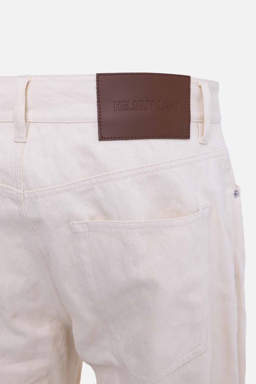 Helmut Lang men's bootcut jeans in muslin, logo detail, brown leather back patch above rear pocket