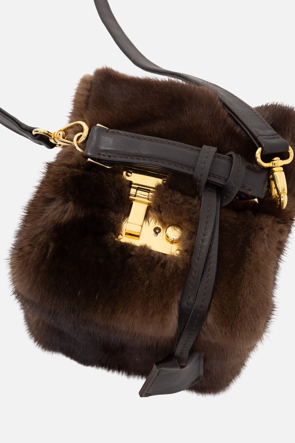 Frenzy women's mink fur box bag in brown, hardware close-up, gold-tone clasp with stitched leather tab