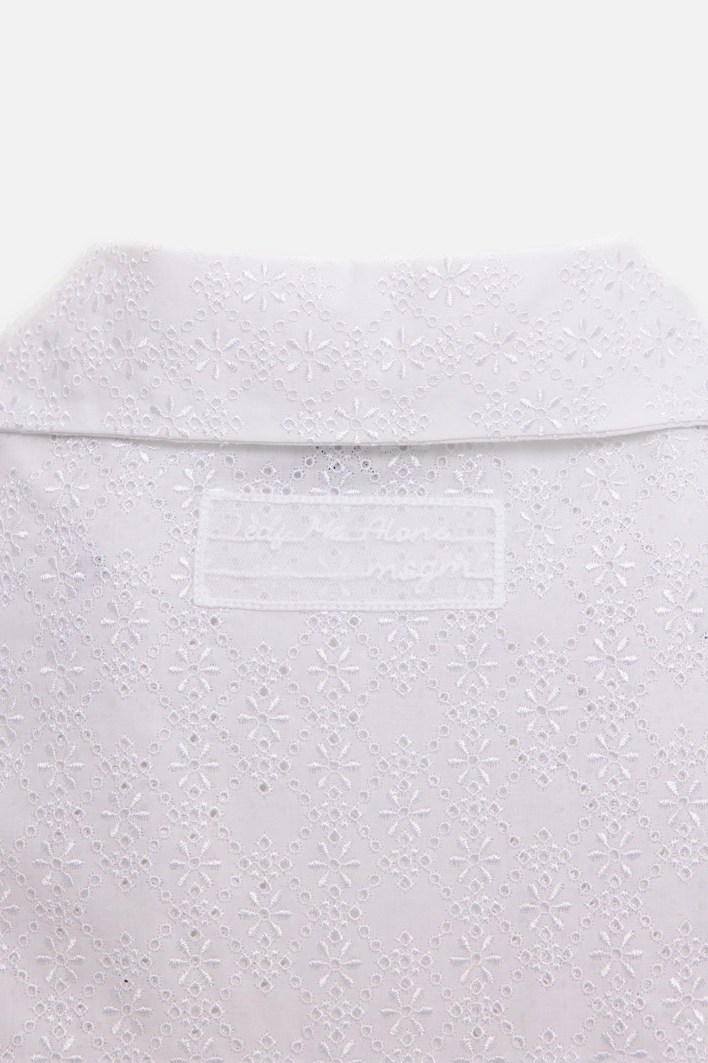 MSGM women's T-shirt in white, collar-detail view, floral eyelet embroidery and tonal logo label