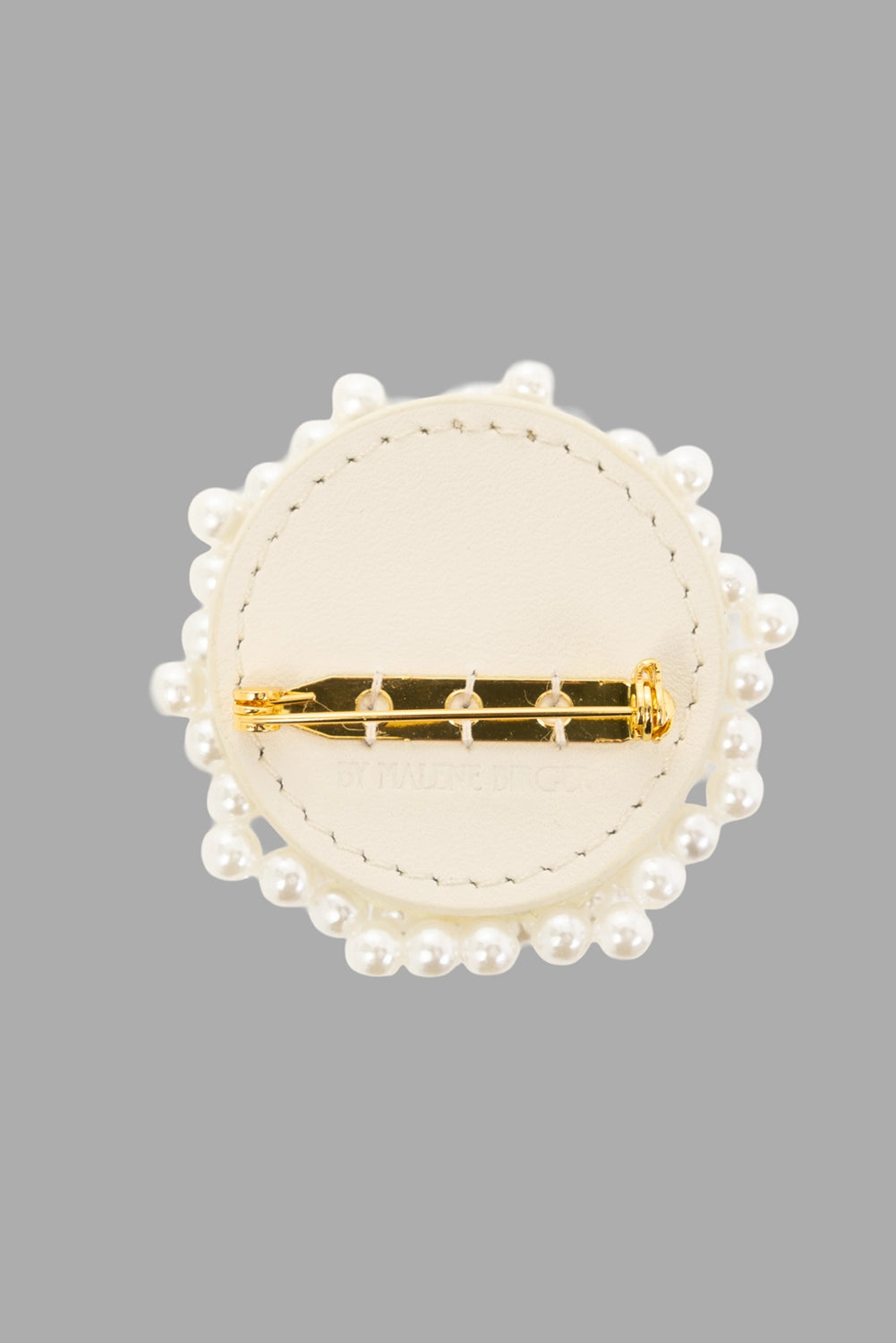 By Malene Birger women's brooch in Soft White, front view, clustered faux pearls with gold monogram charm