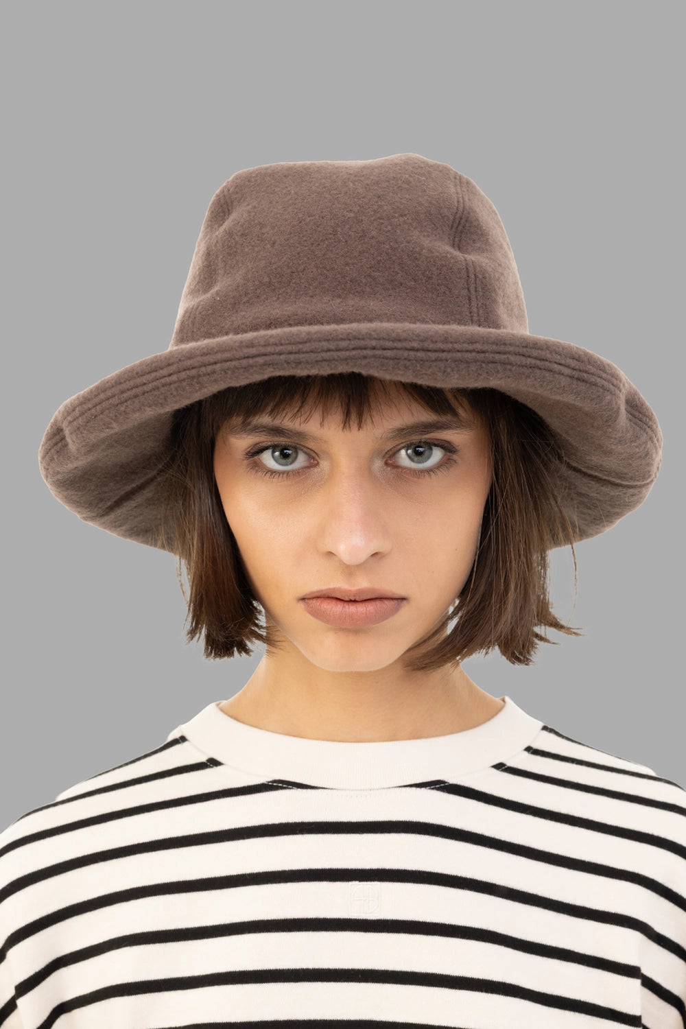 KIJIMA TAKAYUKI unisex wool felt bucket hat in taupe, front view, rolled brim and soft crown.