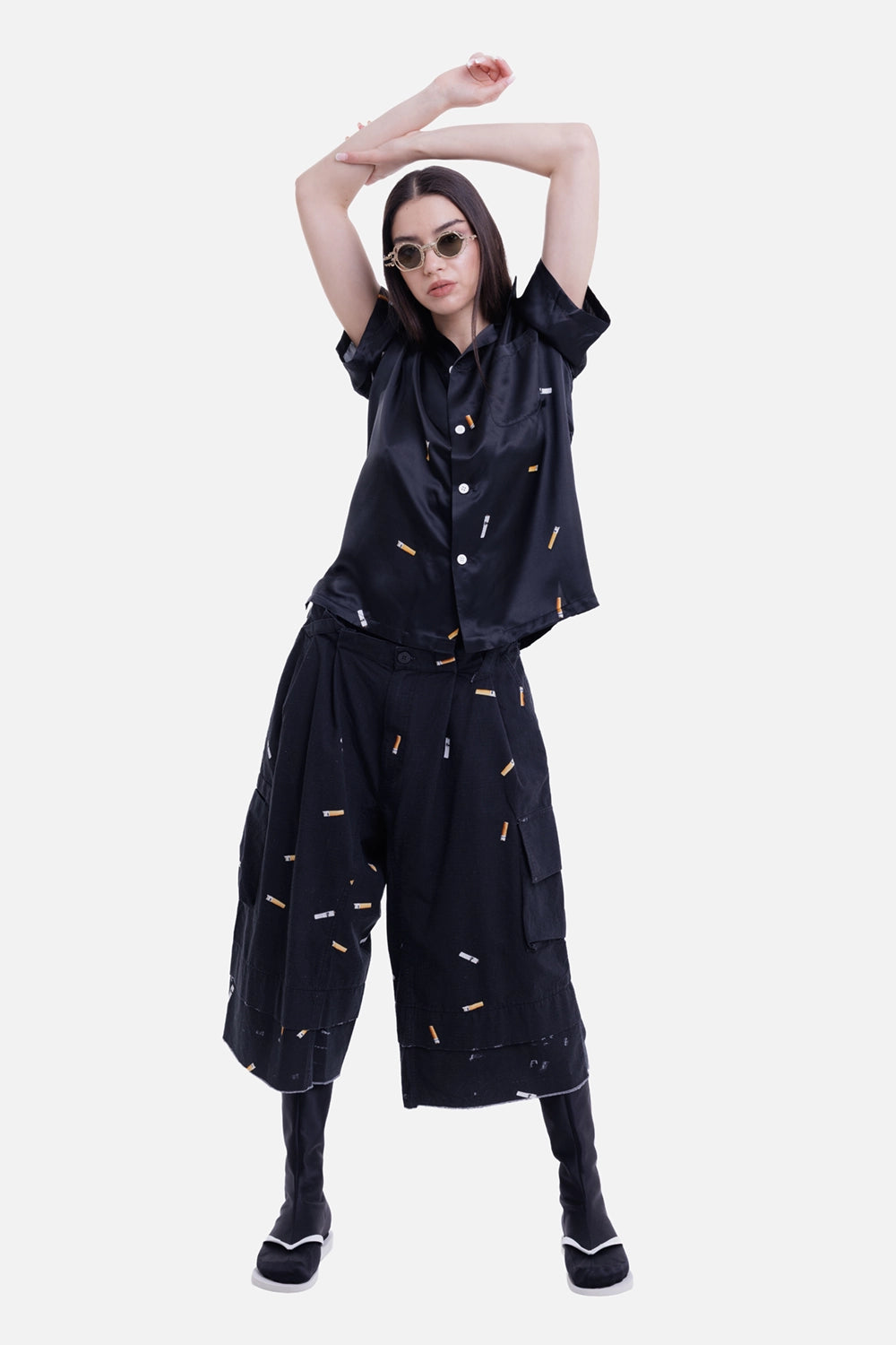 Natasha Zinko women's black cabana shirt, model view with cigarette print and matching trousers
