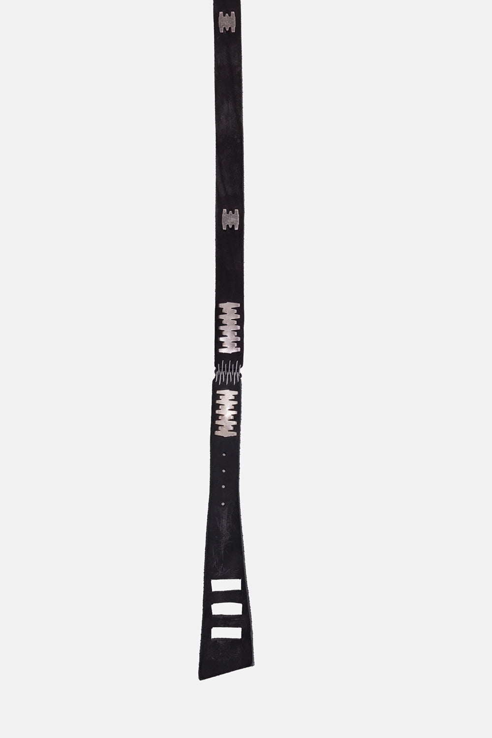 Isaac Sellam unisex calf leather belt in black, full-length view with silver staple hardware and tapered end