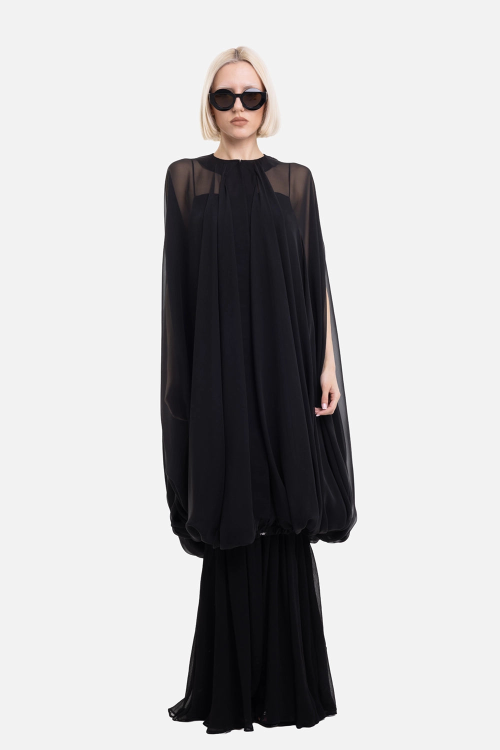 Rick Owens women's cape in black, on-model full-length view, sheer shoulders and gathered bubble hem