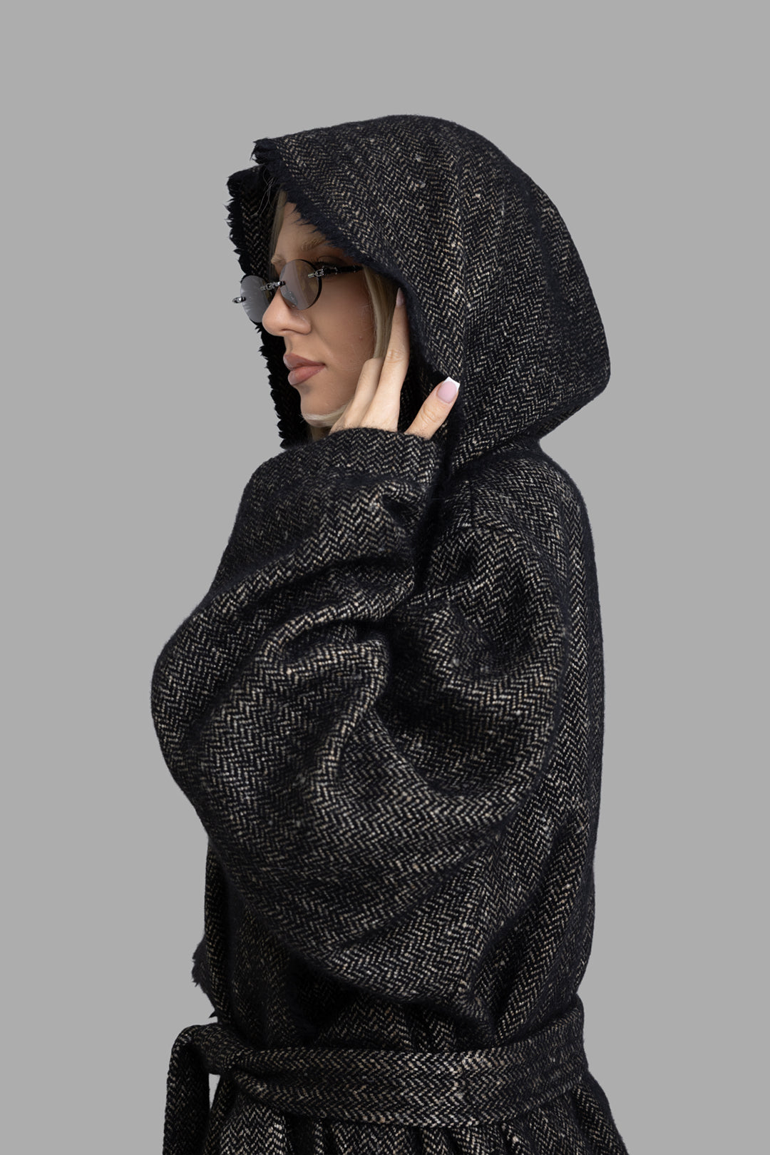 Uma Wang women's black and tan cardigan coat, side view close-up of oversized hood and fringed edge