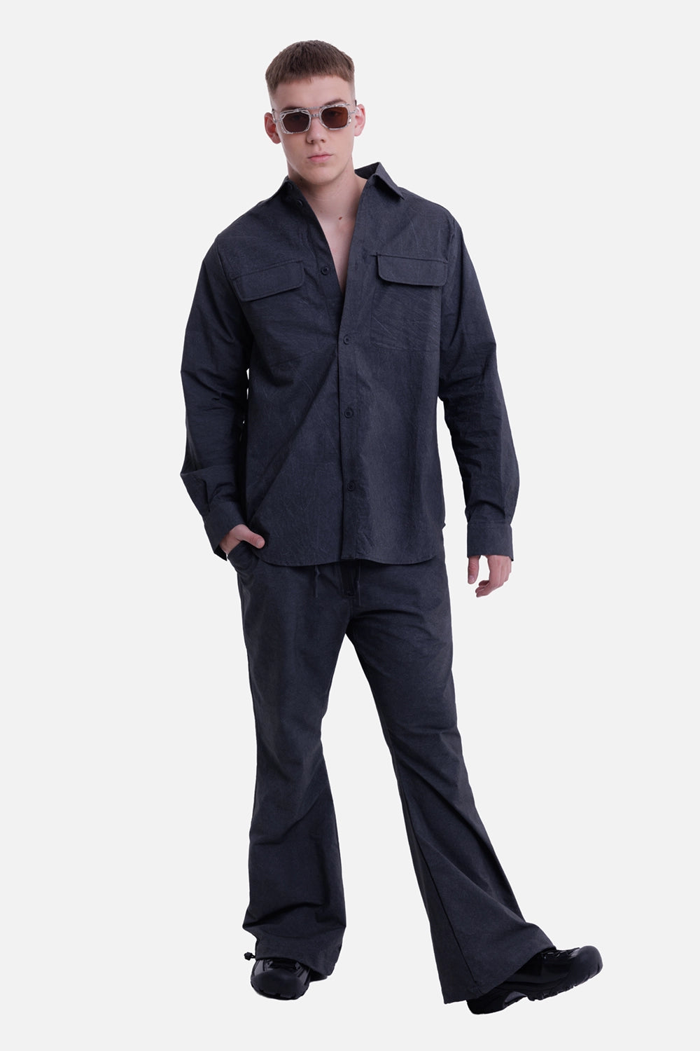 Justin Gall men's cargo drifter shirt in black enzyme, full-length on-model view with oversized chest flap pockets