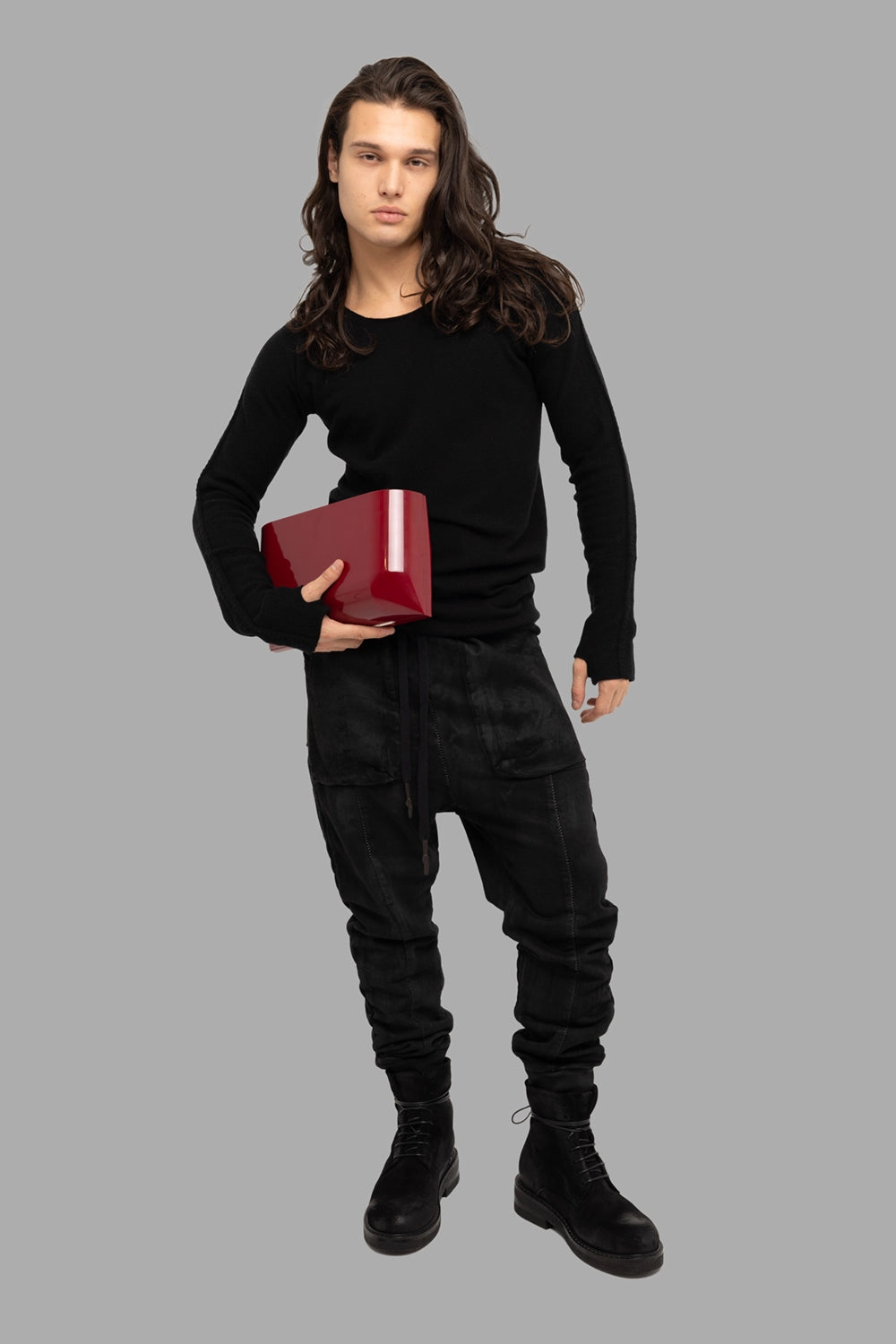 Isaac Sellam Experience men’s cashmere crewneck in black, on-model full length, slim longline fit with thumbholes.