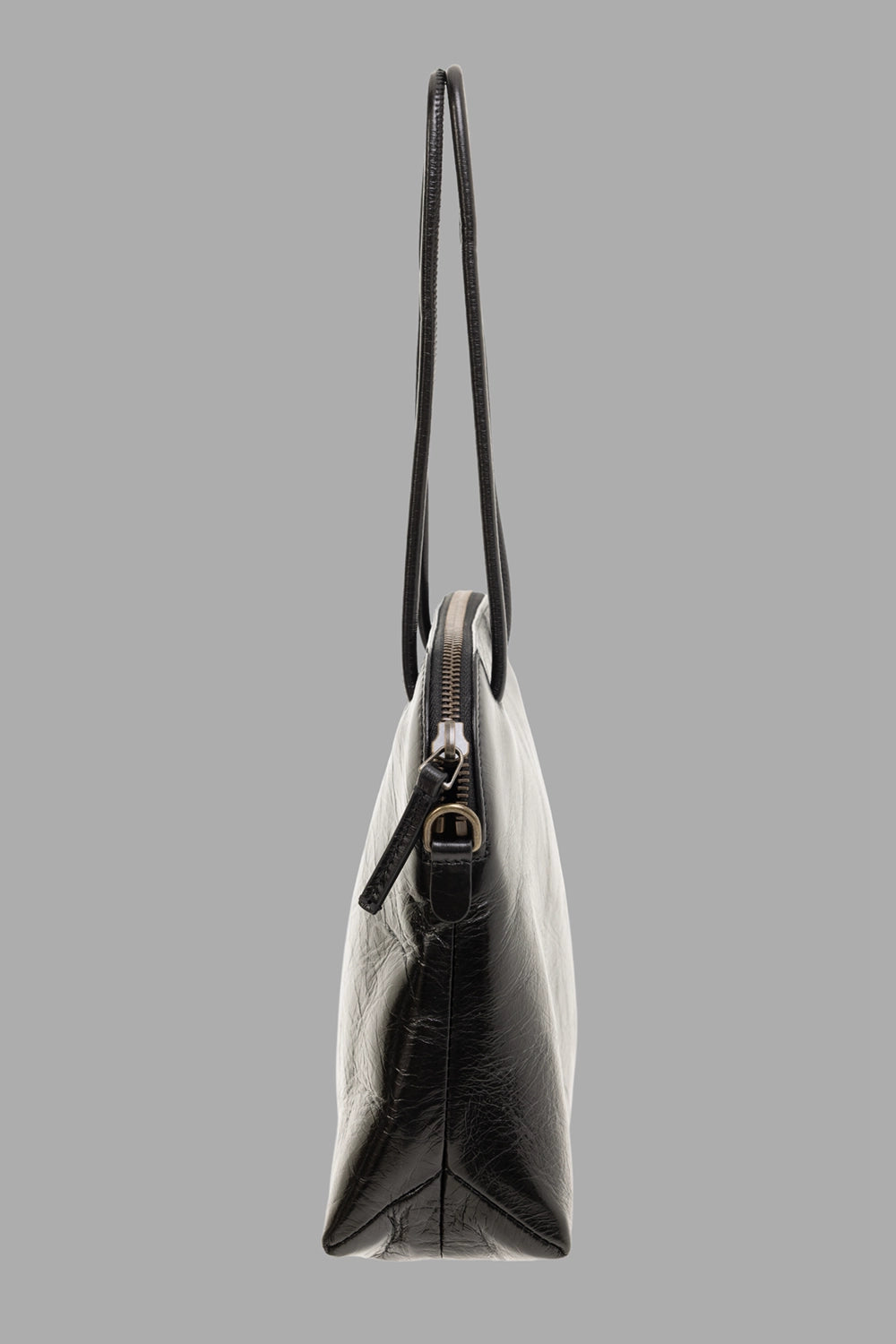 Uma Wang women’s clutch bag in black, fabric close-up showing crinkled calf leather texture