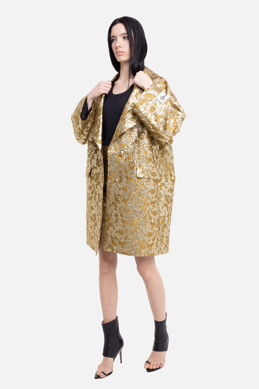 Des Phemmes women's cocoon coat in gold/olive, on-model full-length view, oversized lapels and floral jacquard
