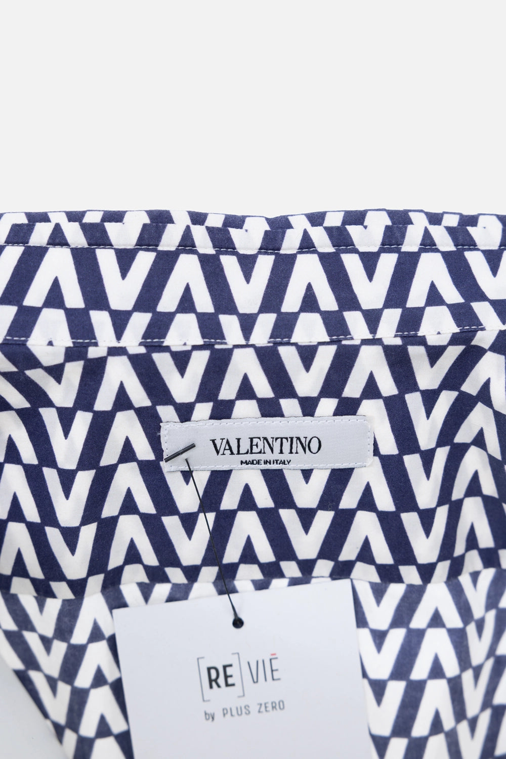 Pre-owned Valentino cotton shirt in navy and white, label close-up, Valentino neck label with hangtag