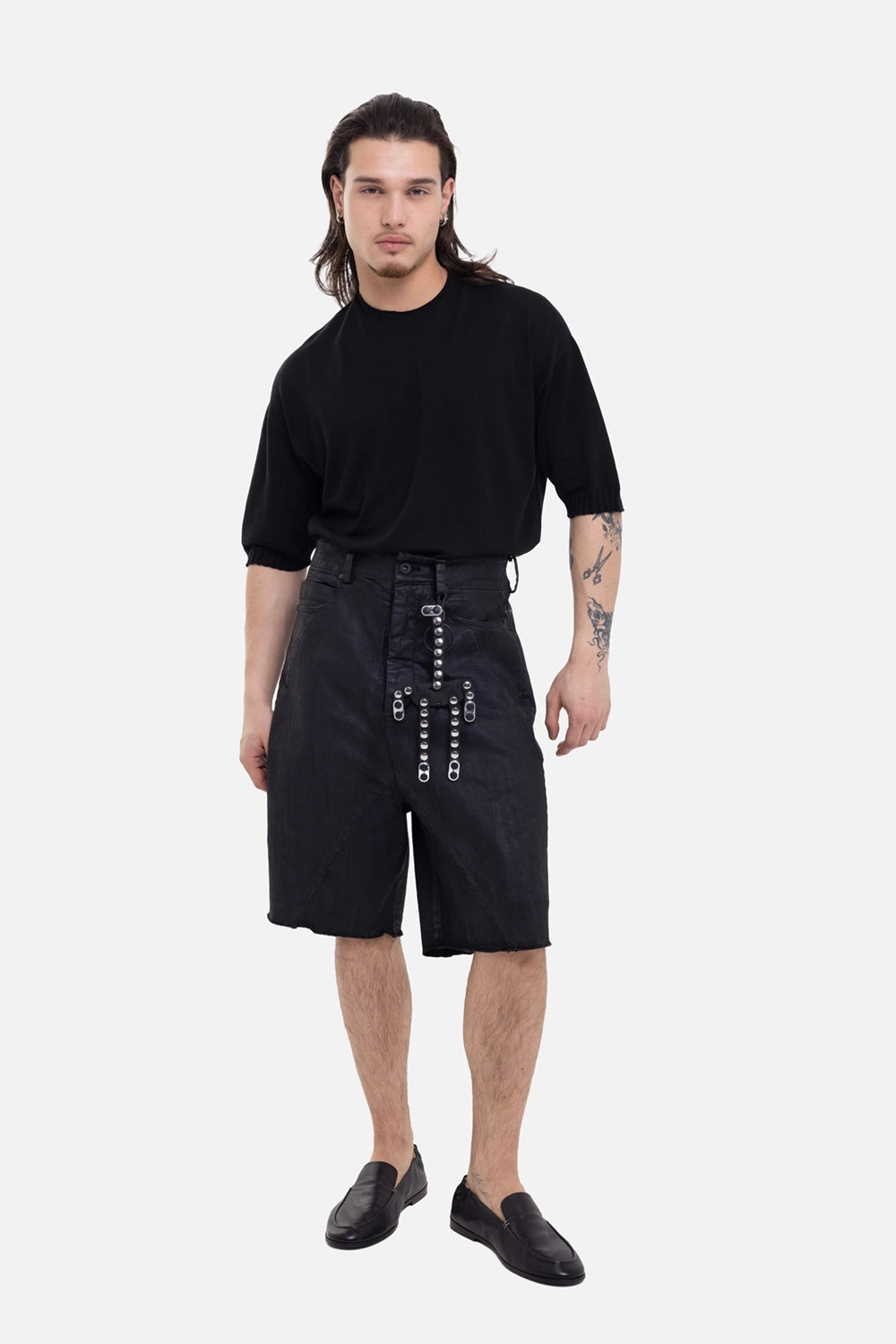 MD75 men's Cracked Coated Denim Shorts in Black Leather, on-model full-length with knee cut and studded detail